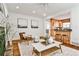Cozy living room featuring hardwood floors, a decorative fireplace, and an open view to the kitchen at 1362 Briarcliff Ne Rd, Atlanta, GA 30306