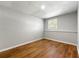 Finished basement space with wood-look flooring and natural light from a window at 2663 Lowell Dr, Morrow, GA 30260
