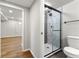 Bathroom features a glass enclosed shower and leads into an adjacent finished basement area at 2663 Lowell Dr, Morrow, GA 30260