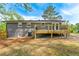 Back of home featuring an expansive deck perfect for relaxation with views of the backyard at 2663 Lowell Dr, Morrow, GA 30260