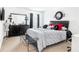 Comfortable bedroom with a modern design, black furniture, and ample natural light at 3060 Elmwood Ct, College Park, GA 30349