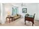 Versatile bedroom space perfect for a sitting room or office, enhanced by natural light and neutral decor at 3060 Elmwood Ct, College Park, GA 30349