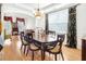 Elegant dining room featuring hardwood floors, a chandelier, and classic furnishings at 3060 Elmwood Ct, College Park, GA 30349
