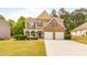 Charming two-story home with a brick and siding facade, two-car garage, and well-manicured lawn at 3060 Elmwood Ct, College Park, GA 30349