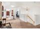 Upstairs hallway with multiple doorways and staircase leading to the lower level at 3060 Elmwood Ct, College Park, GA 30349
