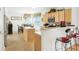Functional kitchen with an island, breakfast bar, and an adjacent dining area at 3060 Elmwood Ct, College Park, GA 30349