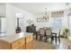 Bright eat-in kitchen with wooden cabinets, stainless appliances, and a dining area near the window at 3060 Elmwood Ct, College Park, GA 30349