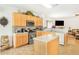 Bright kitchen features stainless steel appliances, light wood cabinets, and center island at 3060 Elmwood Ct, College Park, GA 30349