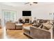 Open living room with a fireplace, plush seating, and sliding glass doors to the patio at 3060 Elmwood Ct, College Park, GA 30349