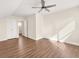 Spacious bedroom with hardwood floors, a ceiling fan, and natural lighting at 4343 Ainsley Mill Ln, Duluth, GA 30097