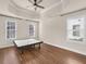 Bedroom with tray ceiling, wood floors, large windows providing ample sunlight at 4343 Ainsley Mill Ln, Duluth, GA 30097