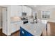 Well-lit kitchen with stainless steel appliances, granite countertops, and view to living area at 4343 Ainsley Mill Ln, Duluth, GA 30097