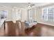 Bright, open living area showcasing hardwood floors and a view into the entryway and kitchen at 4343 Ainsley Mill Ln, Duluth, GA 30097