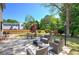 Expansive backyard with patio set, swing, and lush landscaping, ideal for outdoor living at 5221 Huntcrest Sw Pl, Mableton, GA 30126