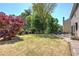 Backyard features a patio, outdoor seating, mature landscaping, and trees at 5221 Huntcrest Sw Pl, Mableton, GA 30126