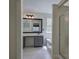 Bright bathroom with grey cabinets, quartz counters, and a walk-in shower at 5221 Huntcrest Sw Pl, Mableton, GA 30126