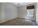 Bedroom featuring carpeted floors, an overhead fan, and a window with curtains at 5221 Huntcrest Sw Pl, Mableton, GA 30126