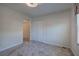 Carpeted bedroom featuring a closet and overhead lighting at 5221 Huntcrest Sw Pl, Mableton, GA 30126