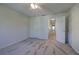 Bedroom featuring carpet, neutral walls, a fan and doorway at 5221 Huntcrest Sw Pl, Mableton, GA 30126