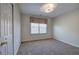 Carpeted bedroom with a window, closet, and overhead lighting at 5221 Huntcrest Sw Pl, Mableton, GA 30126