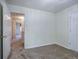 Bedroom with a carpet and open doorway leading to the hallway at 5221 Huntcrest Sw Pl, Mableton, GA 30126