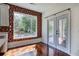 Bright breakfast area featuring hardwood floors and large windows with backyard view at 5221 Huntcrest Sw Pl, Mableton, GA 30126