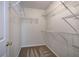 Walk-in closet with installed wire shelving for clothing and storage at 5221 Huntcrest Sw Pl, Mableton, GA 30126