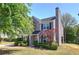 Side view of this charming home, showcasing a well-maintained yard, and complementing architectural details at 5221 Huntcrest Sw Pl, Mableton, GA 30126