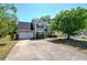 Charming two-story home with a well-manicured lawn and neat landscaping creating a welcoming curb appeal at 5221 Huntcrest Sw Pl, Mableton, GA 30126