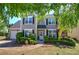 Charming two-story home with a well-manicured lawn and neat landscaping creating a welcoming curb appeal at 5221 Huntcrest Sw Pl, Mableton, GA 30126