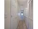 Hallway with carpet, with white doors and walls, leading to other rooms at 5221 Huntcrest Sw Pl, Mableton, GA 30126