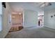 Spacious living room features hardwood floors, natural light, and a view of the adjacent dining area and kitchen at 5221 Huntcrest Sw Pl, Mableton, GA 30126