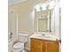 Bathroom featuring a vanity with sink, toilet, and shower/tub combo at 7705 Bellmist Dr, Fairburn, GA 30213