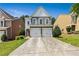 Charming two-story home with a two-car garage and beautiful landscaping, perfect for families at 7705 Bellmist Dr, Fairburn, GA 30213