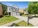 Beautiful two-story home with well-maintained lawn and cozy front yard, great for curb appeal at 7705 Bellmist Dr, Fairburn, GA 30213