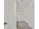 Walk-in closet features carpeted floors, wire shelving, and ample storage space at 7705 Bellmist Dr, Fairburn, GA 30213