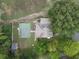 Aerial view of home, showing backyard sport court and mature trees at 821 Tramore Ct, Powder Springs, GA 30127