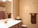Bathroom featuring a white sink, mirror, and decorative towels at 821 Tramore Ct, Powder Springs, GA 30127