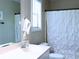 Bathroom featuring a white sink, mirror, and a shower with a white curtain at 821 Tramore Ct, Powder Springs, GA 30127
