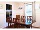 Dining room with white wainscoting, a dark wood table, and seating for four, perfect for formal dinners at 821 Tramore Ct, Powder Springs, GA 30127