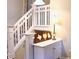 Home's entryway features a white stairway with a wood stained accent piece and lamp on top of a decorative table at 821 Tramore Ct, Powder Springs, GA 30127