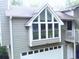 Exterior view featuring a two-story home with attached garage at 821 Tramore Ct, Powder Springs, GA 30127