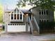 Charming home featuring light gray siding, a two-car garage, and a welcoming stairway to the front door at 821 Tramore Ct, Powder Springs, GA 30127