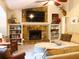 Inviting living room with a stone fireplace, built-in shelves, and comfortable seating for relaxing and entertaining at 821 Tramore Ct, Powder Springs, GA 30127