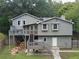Back of house showing deck and stairs, leading to the backyard at 821 Tramore Ct, Powder Springs, GA 30127