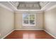 Bedroom with hardwood flooring and coffered ceilings at 1000 Brushystone Dr, Loganville, GA 30052