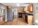Well-equipped kitchen with stainless steel refrigerator and tile backsplash at 1000 Brushystone Dr, Loganville, GA 30052