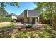 The backyard features a stone patio and a swing perfect for relaxing outdoors at 192 Adelaide Xing, Acworth, GA 30101