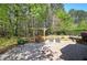 This backyard features a stone patio and a swing perfect for outdoor relaxation at 192 Adelaide Xing, Acworth, GA 30101