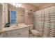 Bright bathroom with a shower and patterned curtain at 192 Adelaide Xing, Acworth, GA 30101